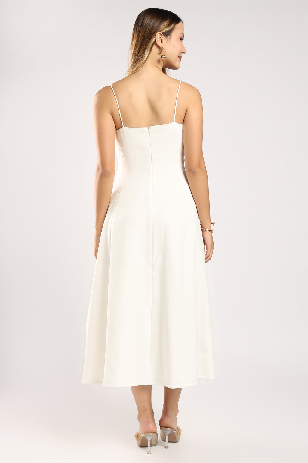 Back view of The Garden Ivory Women's Dress showing the zip closure and flowing fit.
