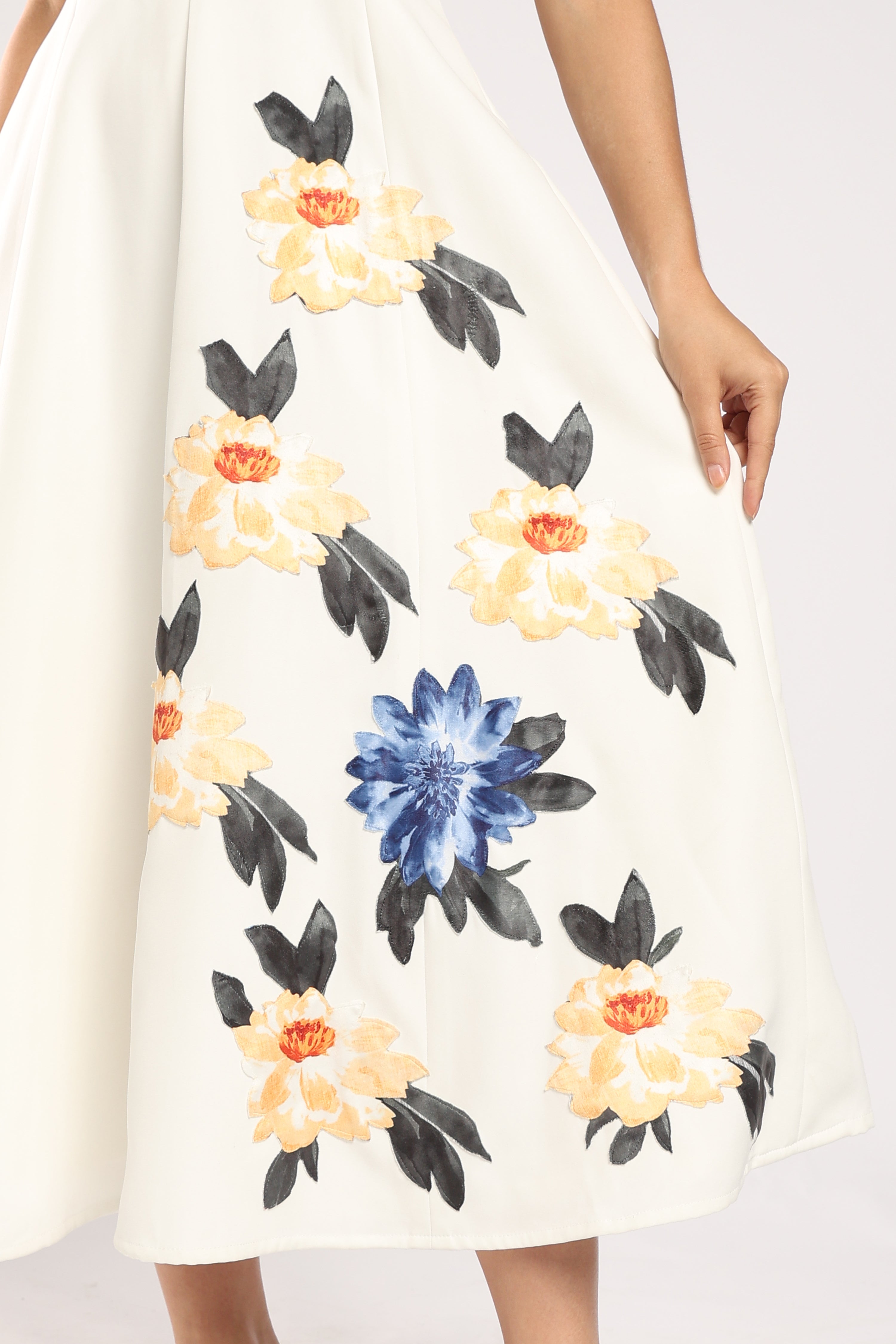 The Garden Ivory Women's Dress featuring handcrafted appliqué detailing.