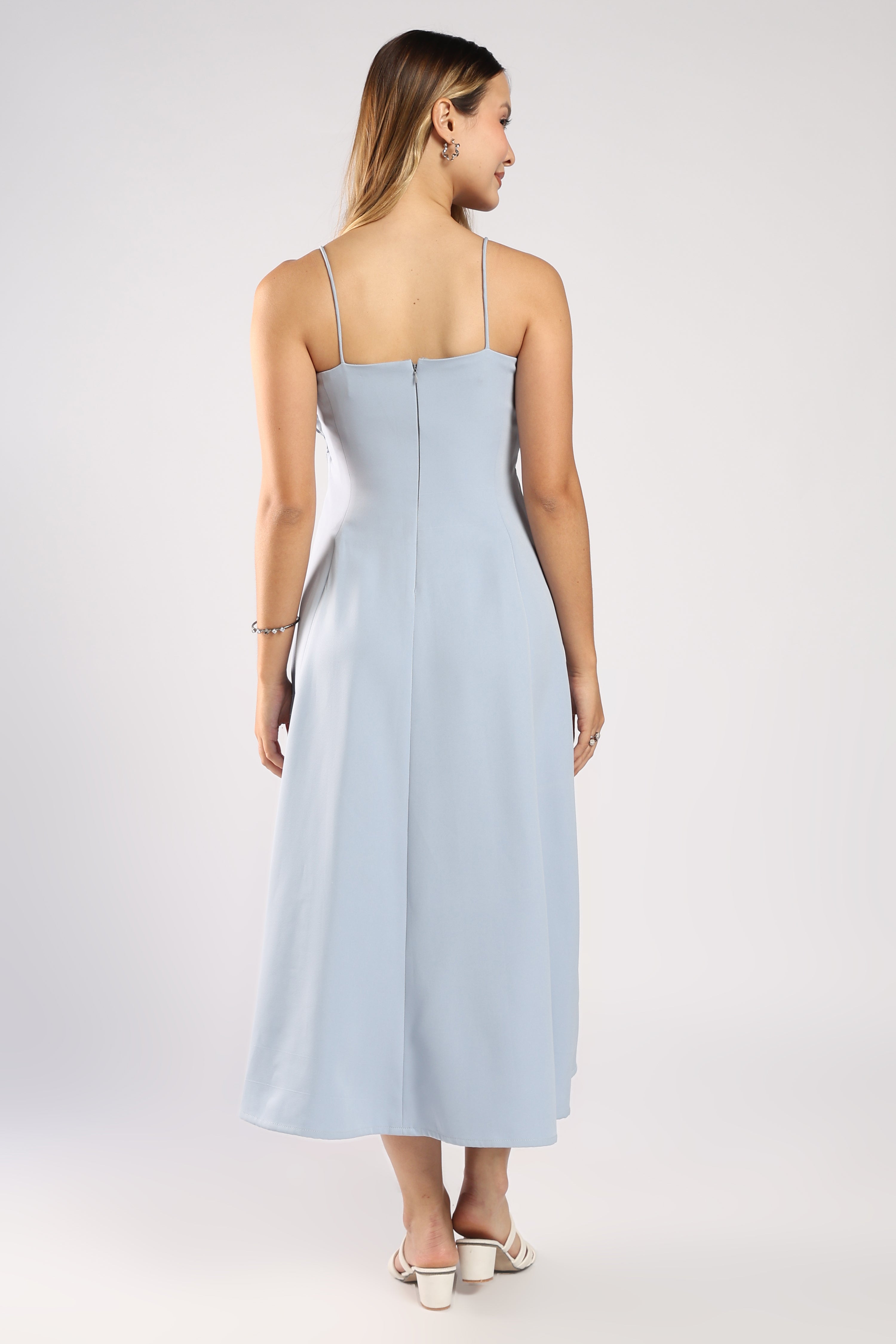 Back view of The Bluebell Ice Blue Women's Dress showing the zip closure and flowing fit.