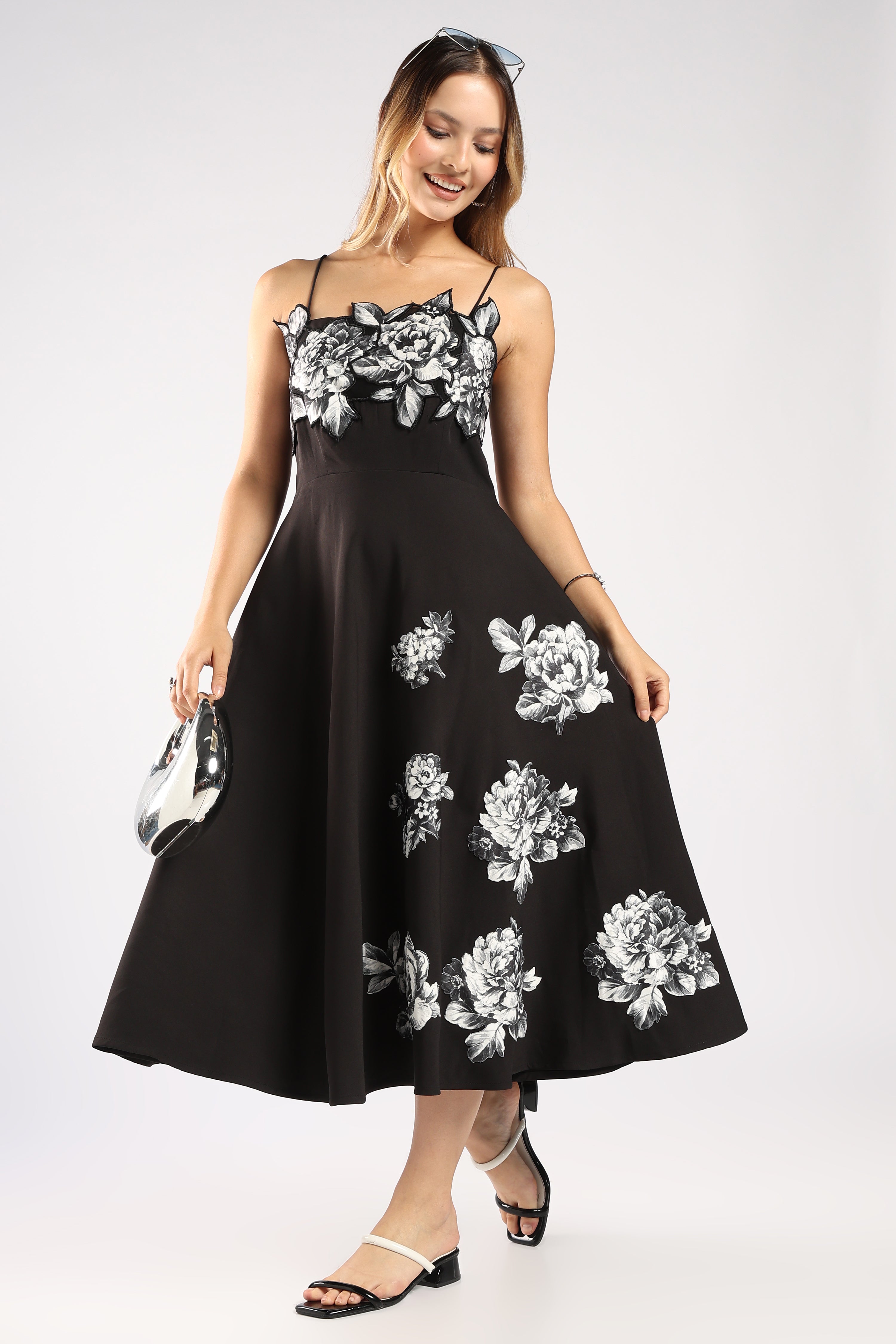 Front view of The Moon Women's Black Dress in imported crepe with a flowy silhouette.
