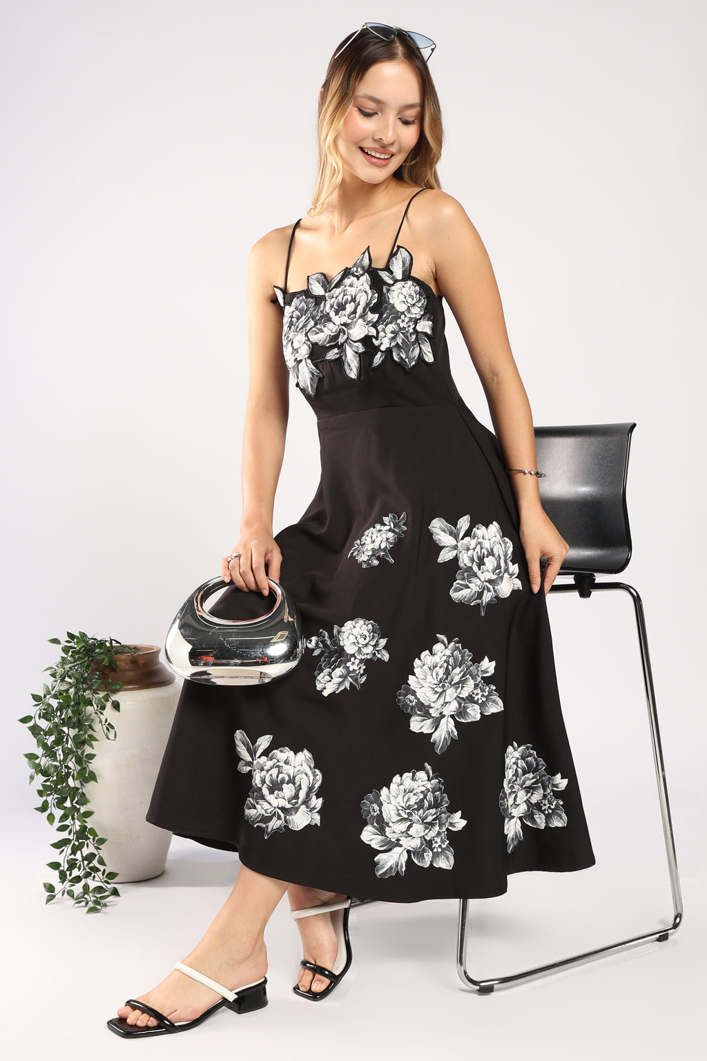 The Moon Women's Black Dress featuring handcrafted appliqué detailing.