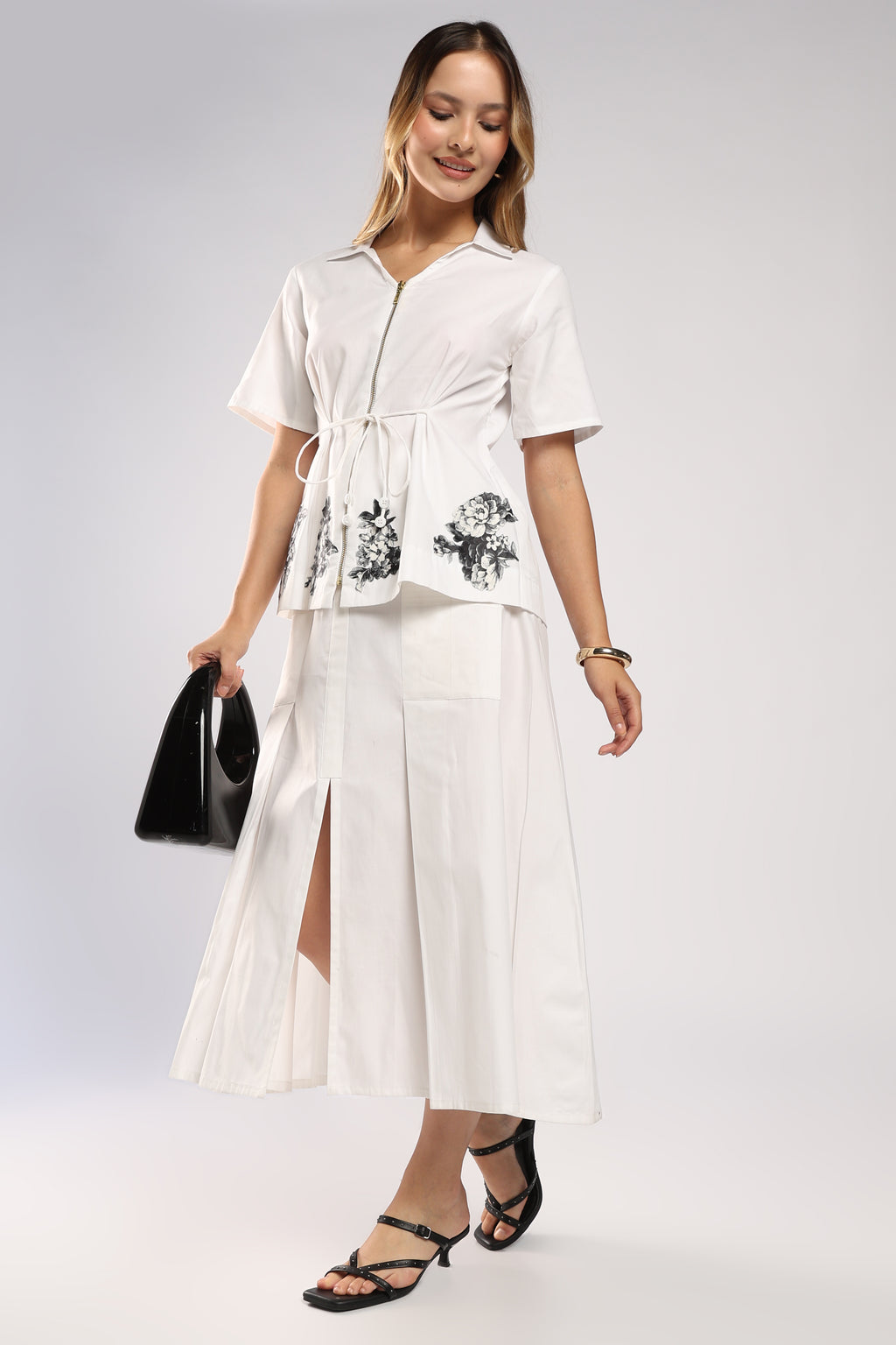 The Flora White Women's Skirt Set featuring handcrafted appliqué detailing.