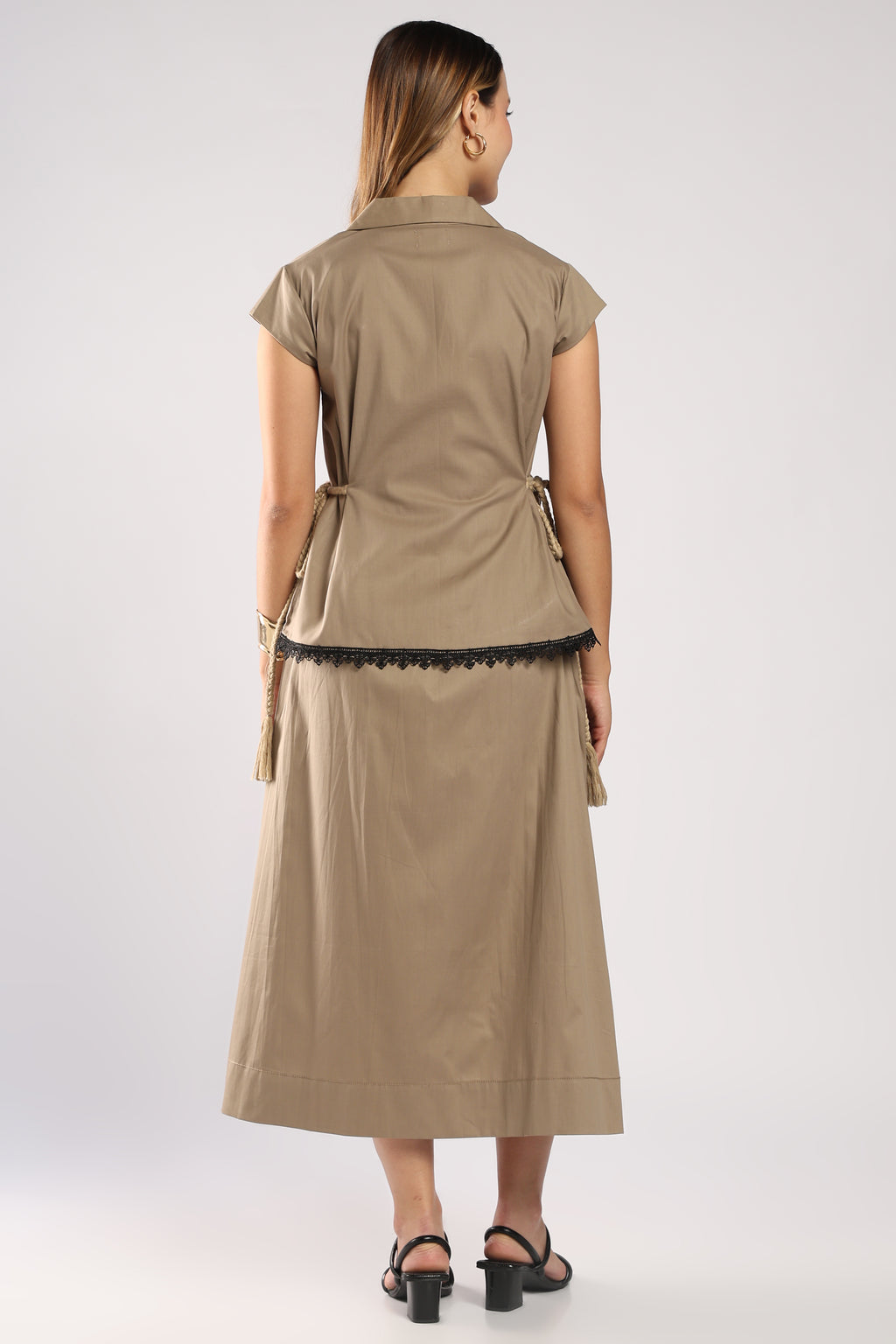 Back view of The Mia Khaki Women's Skirt Set showing the structured top.