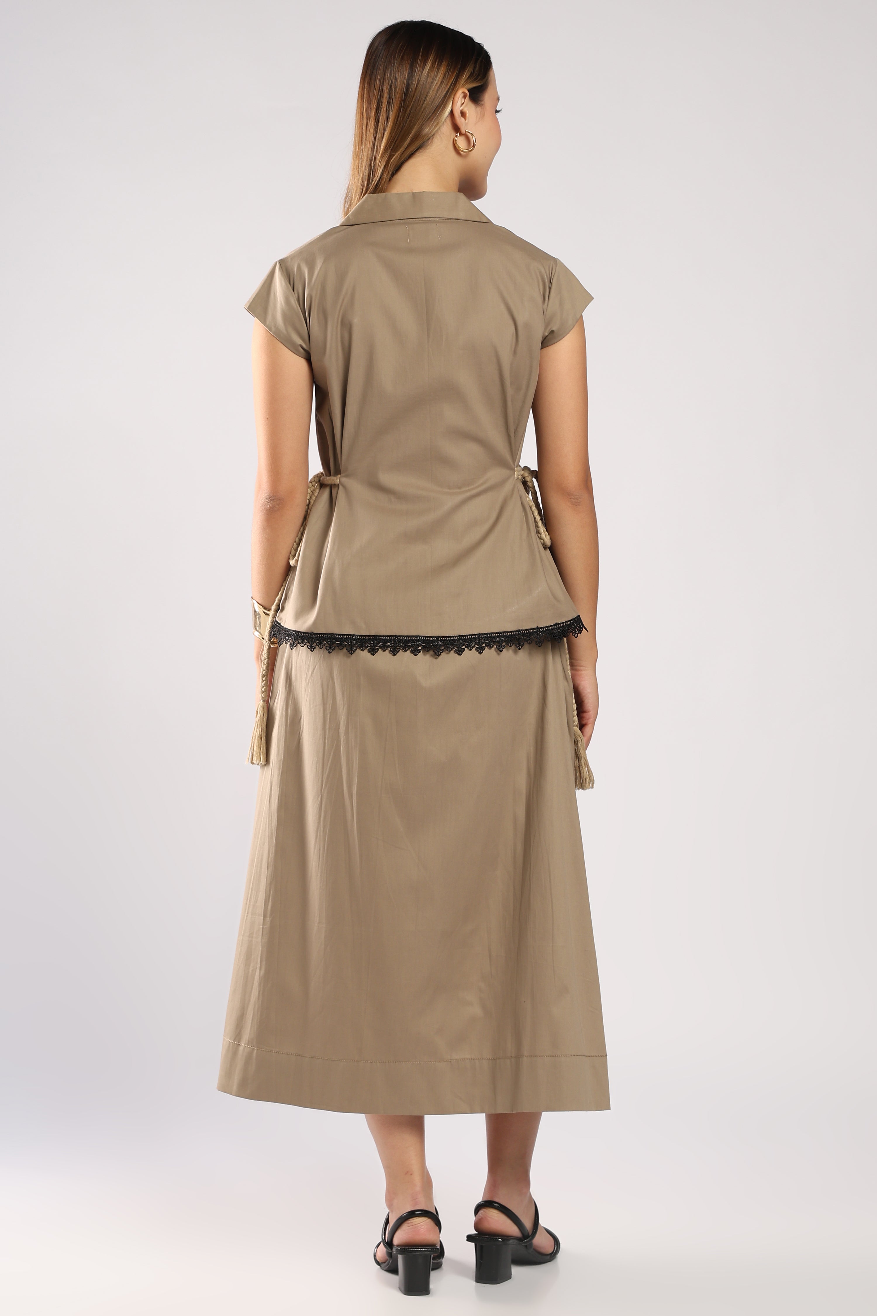 Back view of The Mia Khaki Women's Skirt Set showing the structured top.