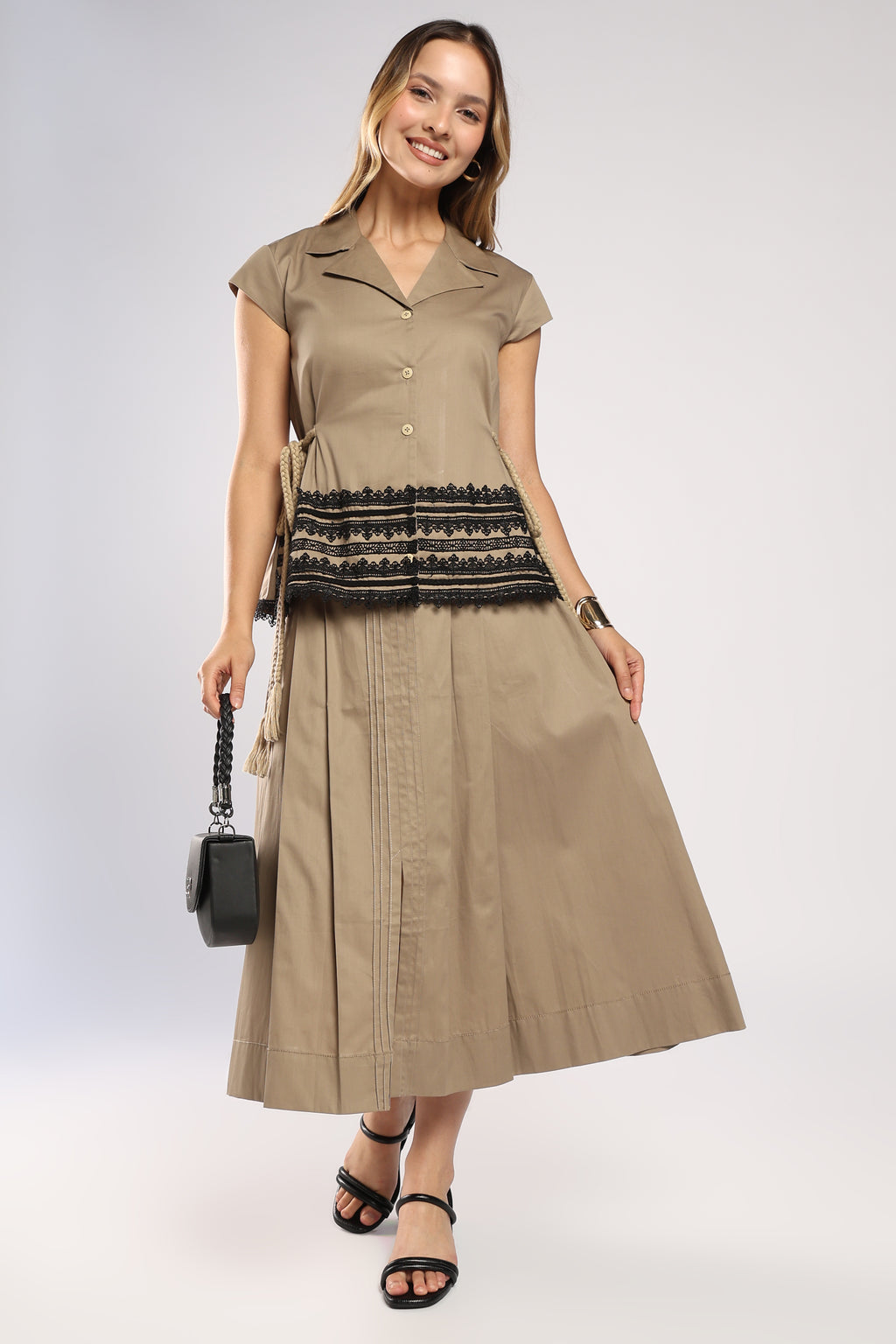 Front view of The Mia Khaki Women's Skirt Set showing the structured top and pleated skirt.