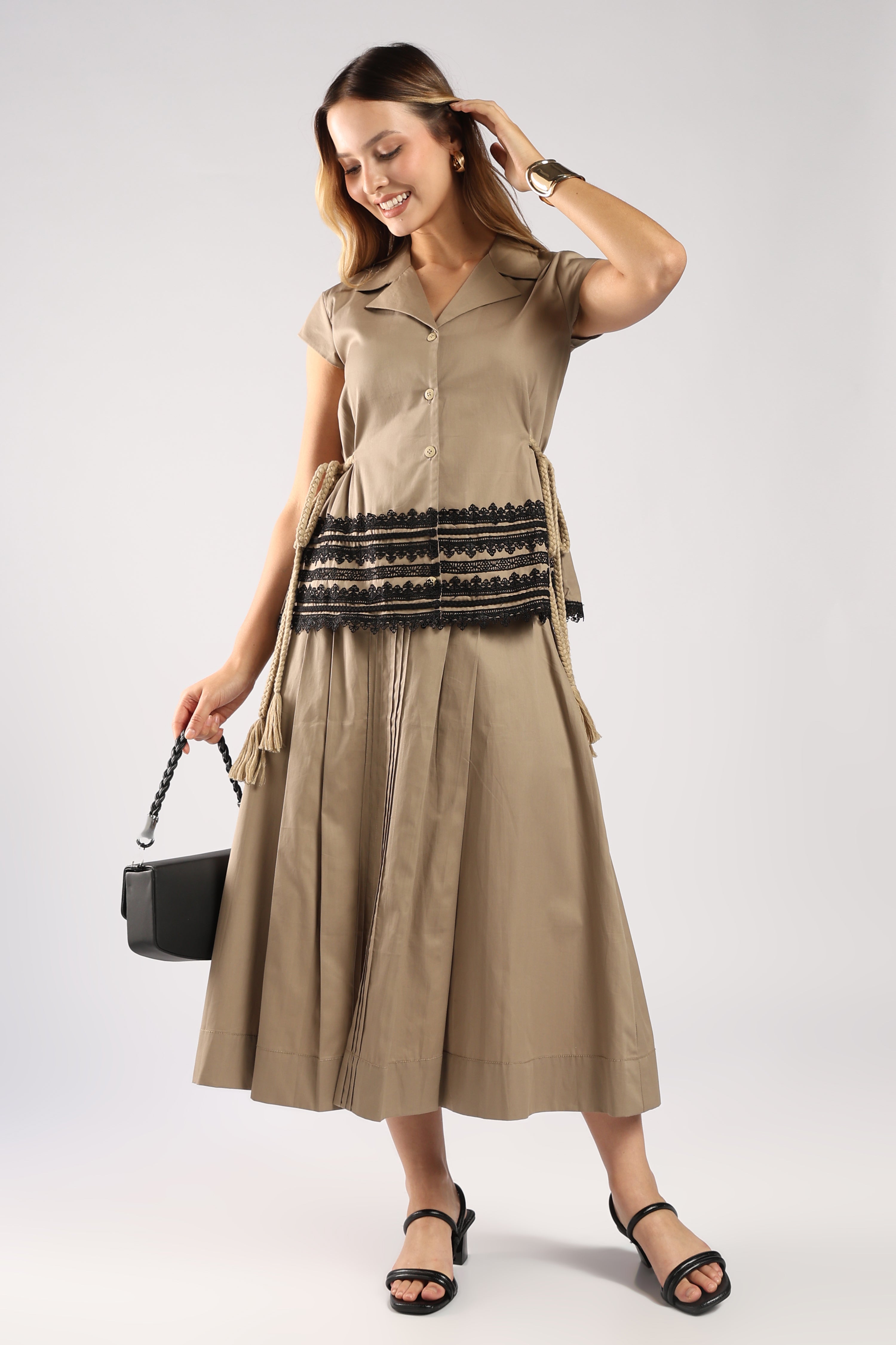 Front view of The Mia Khaki Women's Skirt Set showing the structured top and pleated skirt.