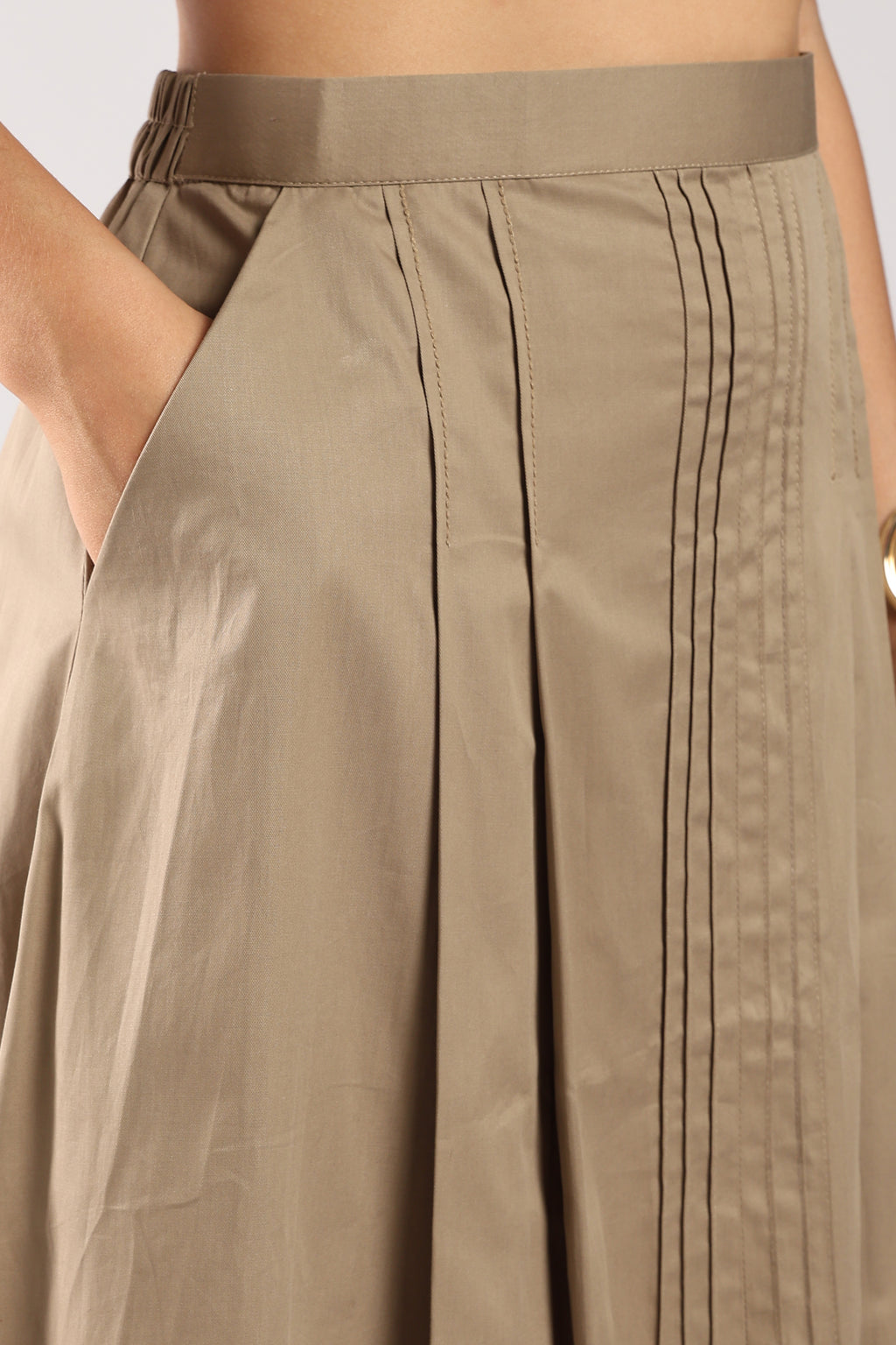 Front view of The Mia Khaki Women's Skirt Set showing the pleated skirt with pockets.