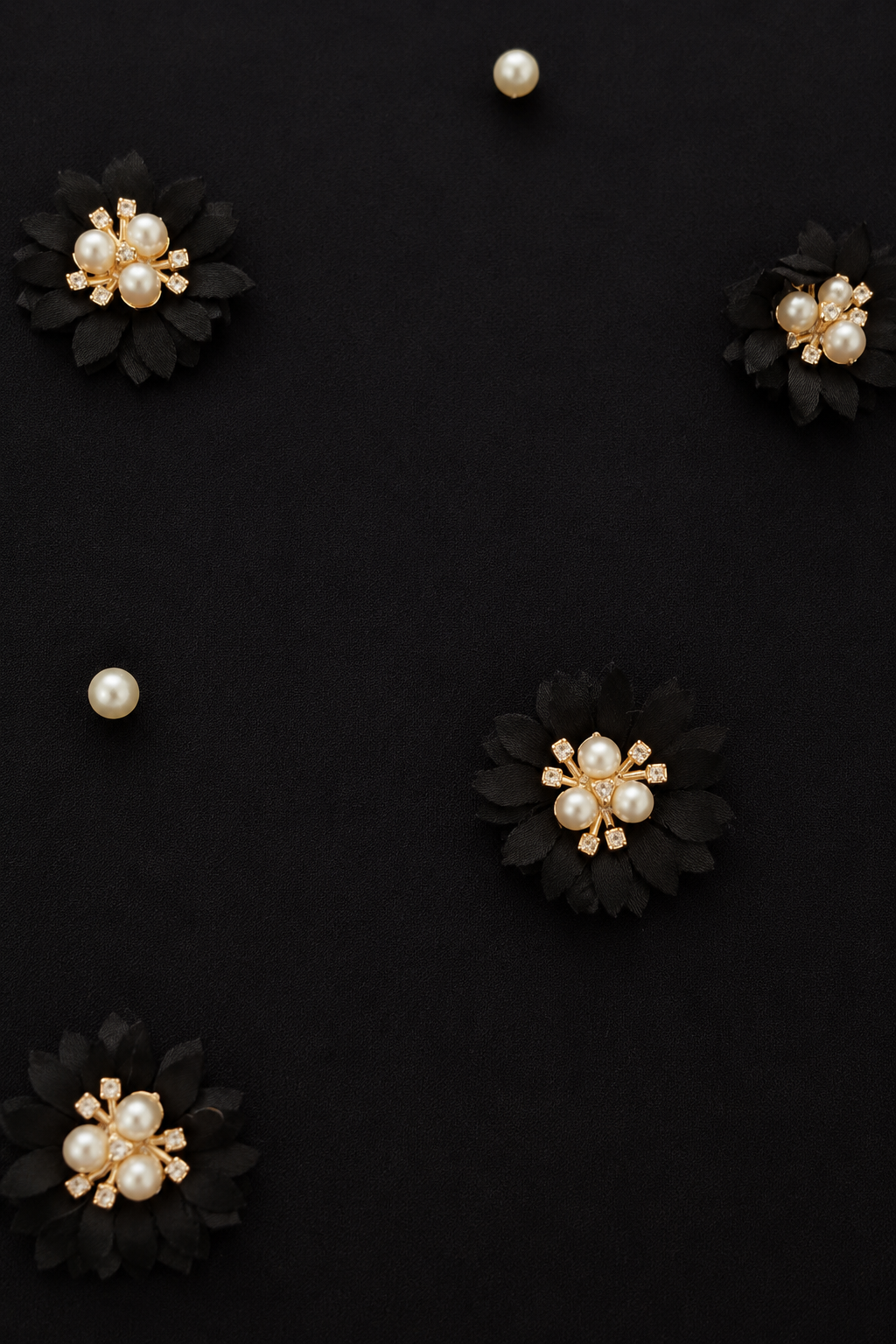 Close-up of The Lotus Women's T-Shirt showcasing the handcrafted lotus-inspired floral detailing on French Terry fabric.