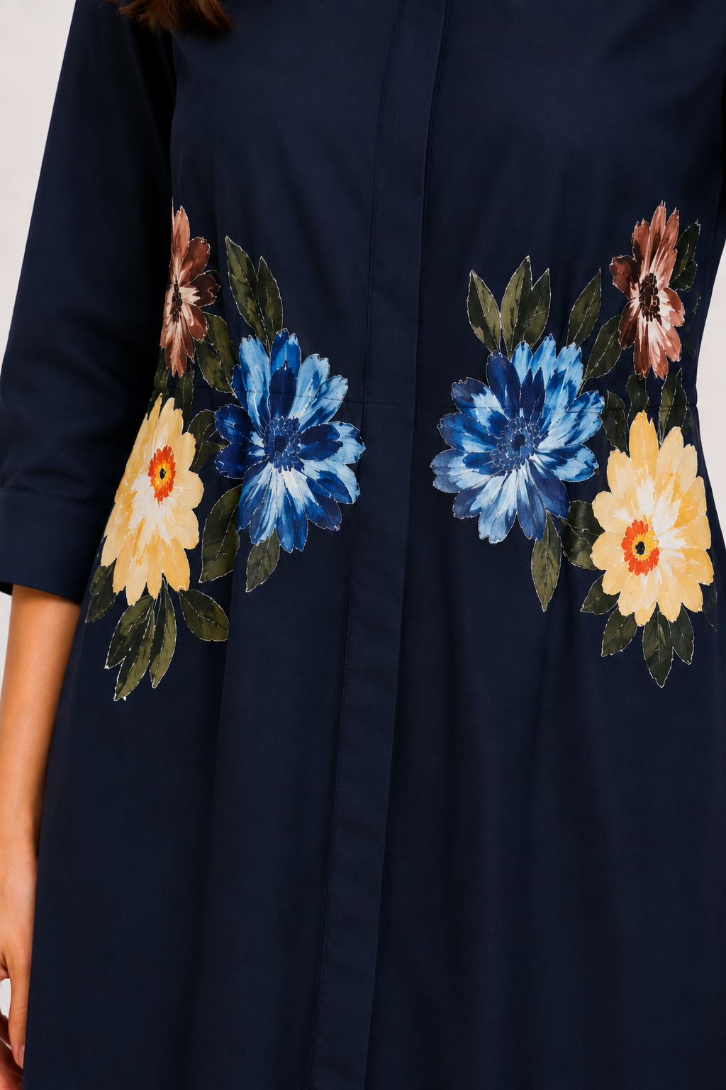 The Bloom Navy Blue Shirt Dress featuring floral detailing around the waist.