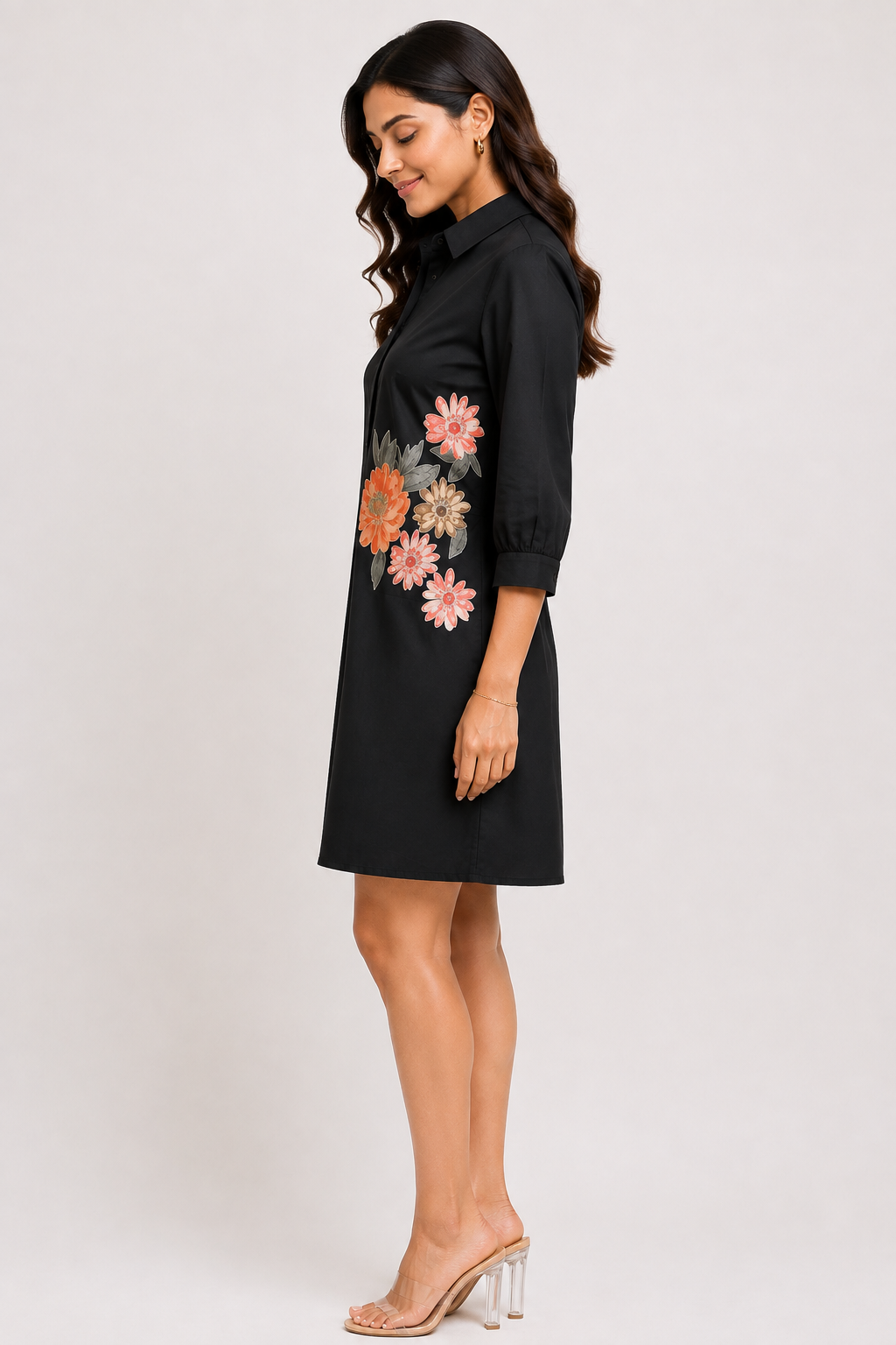 The Bloom Black Shirt Dress featuring floral detailing around the waist.
