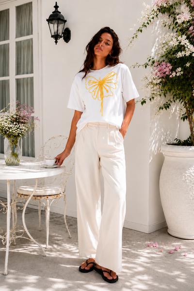 Model wearing the Butterfly Knot Women's T-Shirt styled for an elevated casual look.
