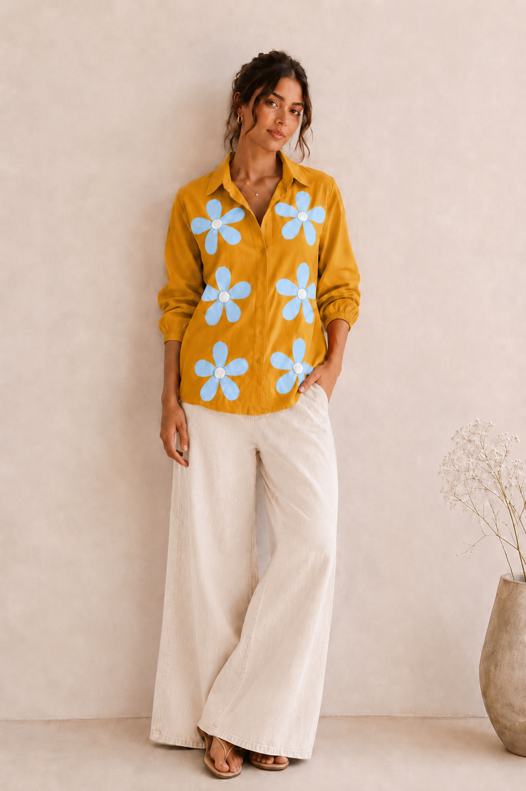 Model wearing The Daisy Women's Shirt styled for a smart casual daytime outfit.