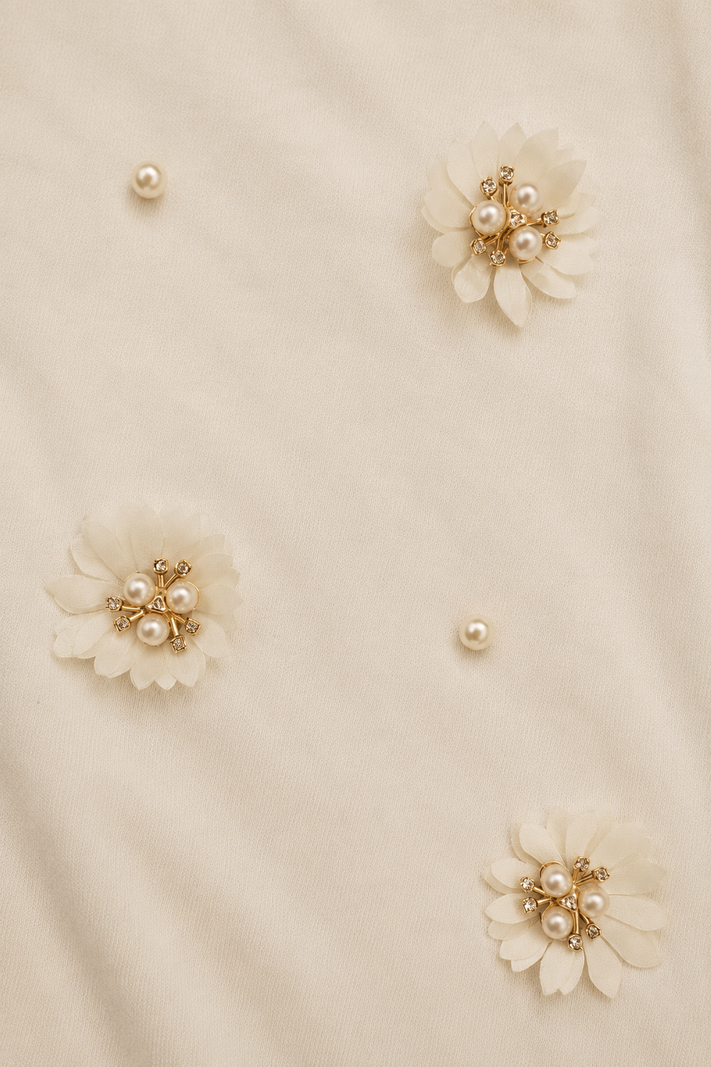 Close-up of The Lotus Women's T-Shirt showcasing the handcrafted lotus-inspired floral detailing on French Terry fabric.