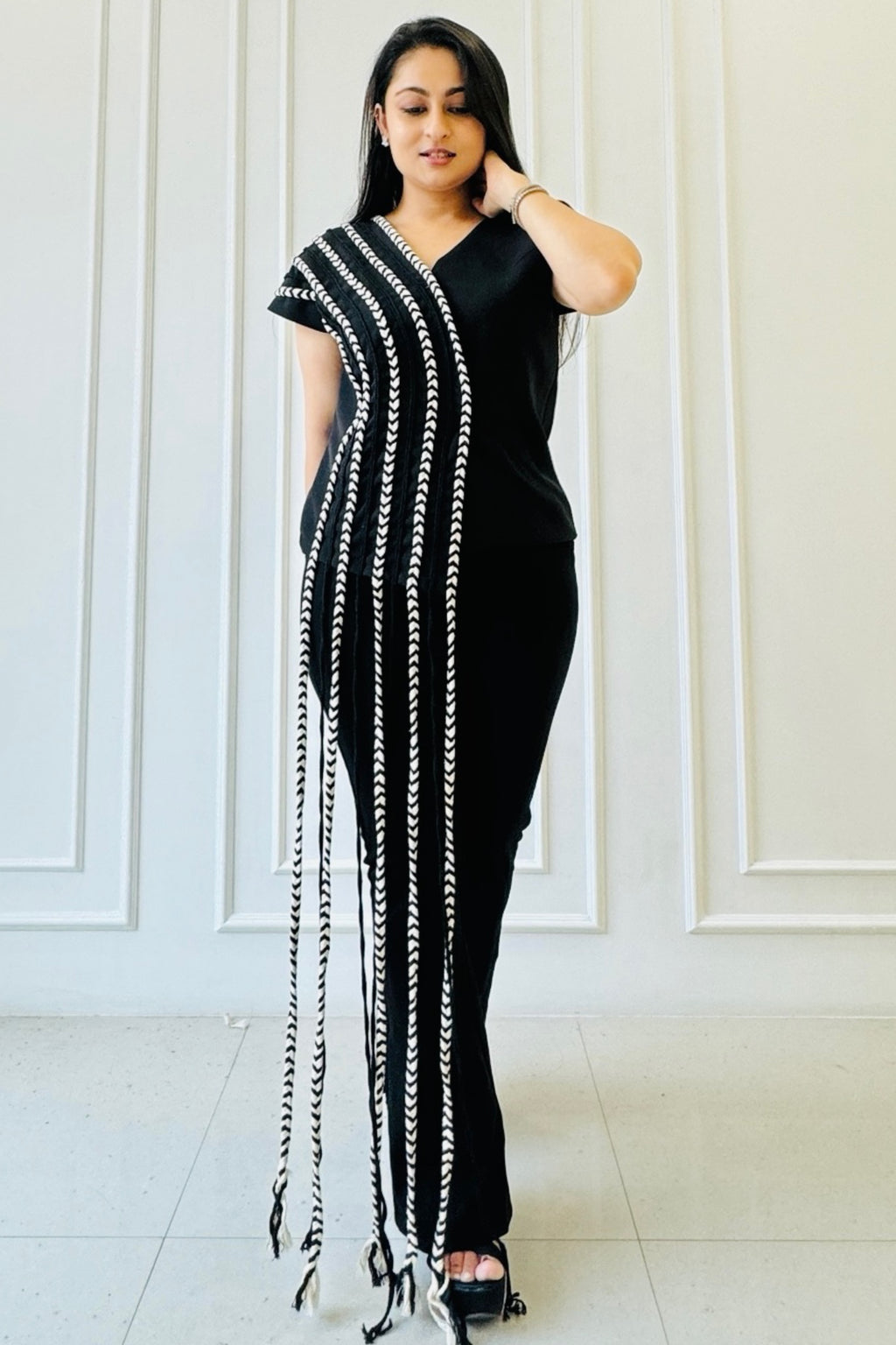 The Braided Black Co-ord Set featuring a statement top with handcrafted braided detailing and straight-fit trousers.