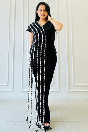 The Braided Black Co-ord Set featuring a statement top with handcrafted braided detailing and straight-fit trousers.