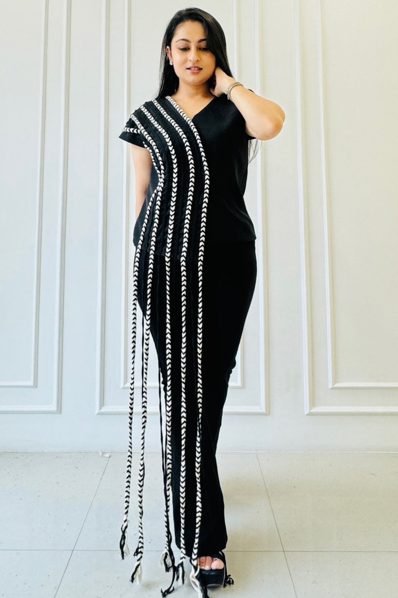 The Braided Black Co-ord Set featuring a statement top with handcrafted braided detailing and straight-fit trousers.