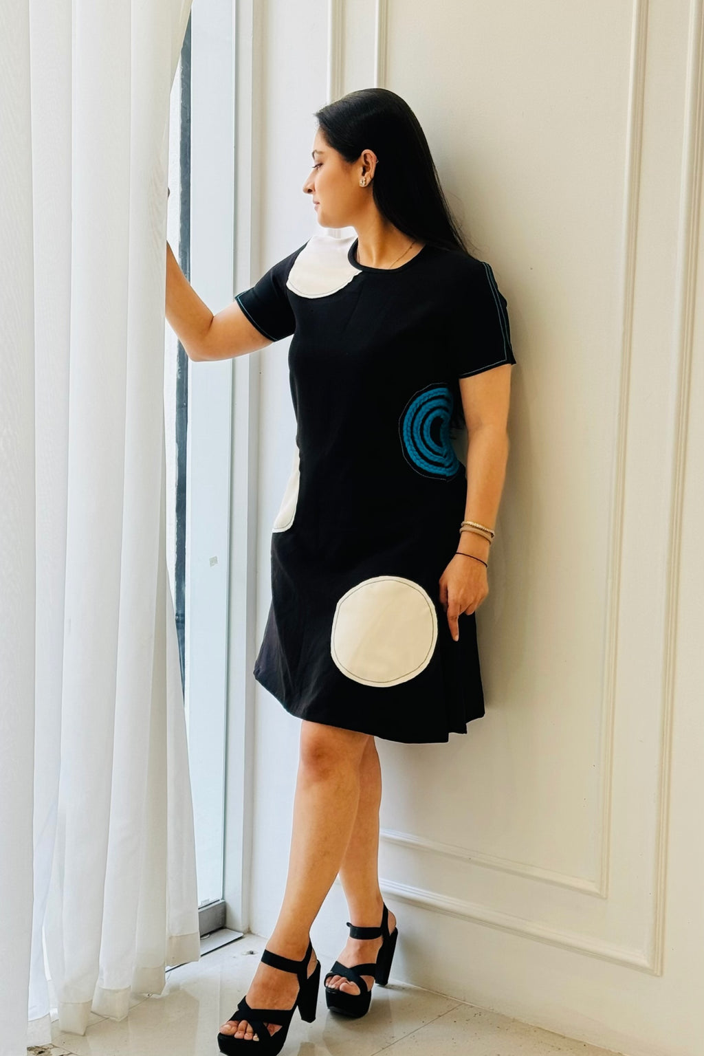 Close-up of The Dot Women's Dress highlighting the appliqué details and handcrafted blue braid.