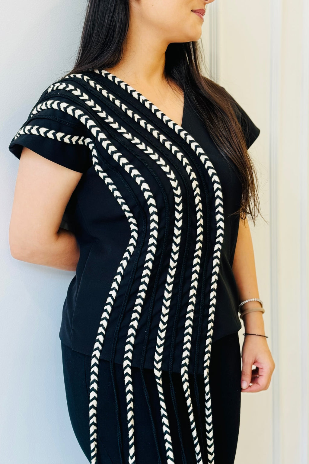 Close-up of The Braided Black Co-ord Set highlighting the flowing handcrafted braids on the statement top.
